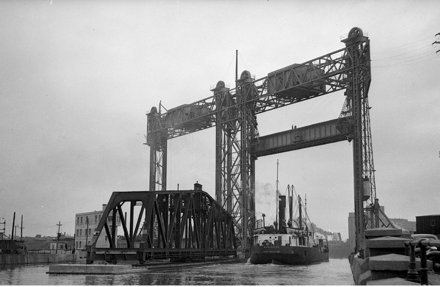 [Image 7 - The swing and lift bridges, Peel Basin, Griffintown, 1943. The Wellington tower is visible at left behind the swing bridge. Source: Archives nationales du Canada, PA202868]