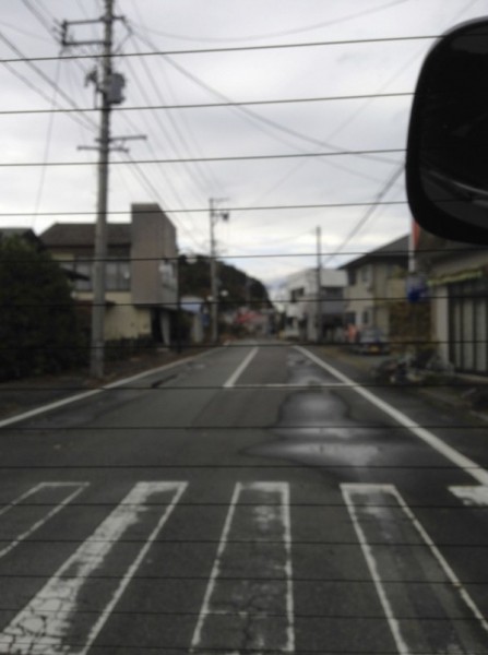 [Image 7. An empty street inside the zone viewed from inside a car, November 10, 2015.]